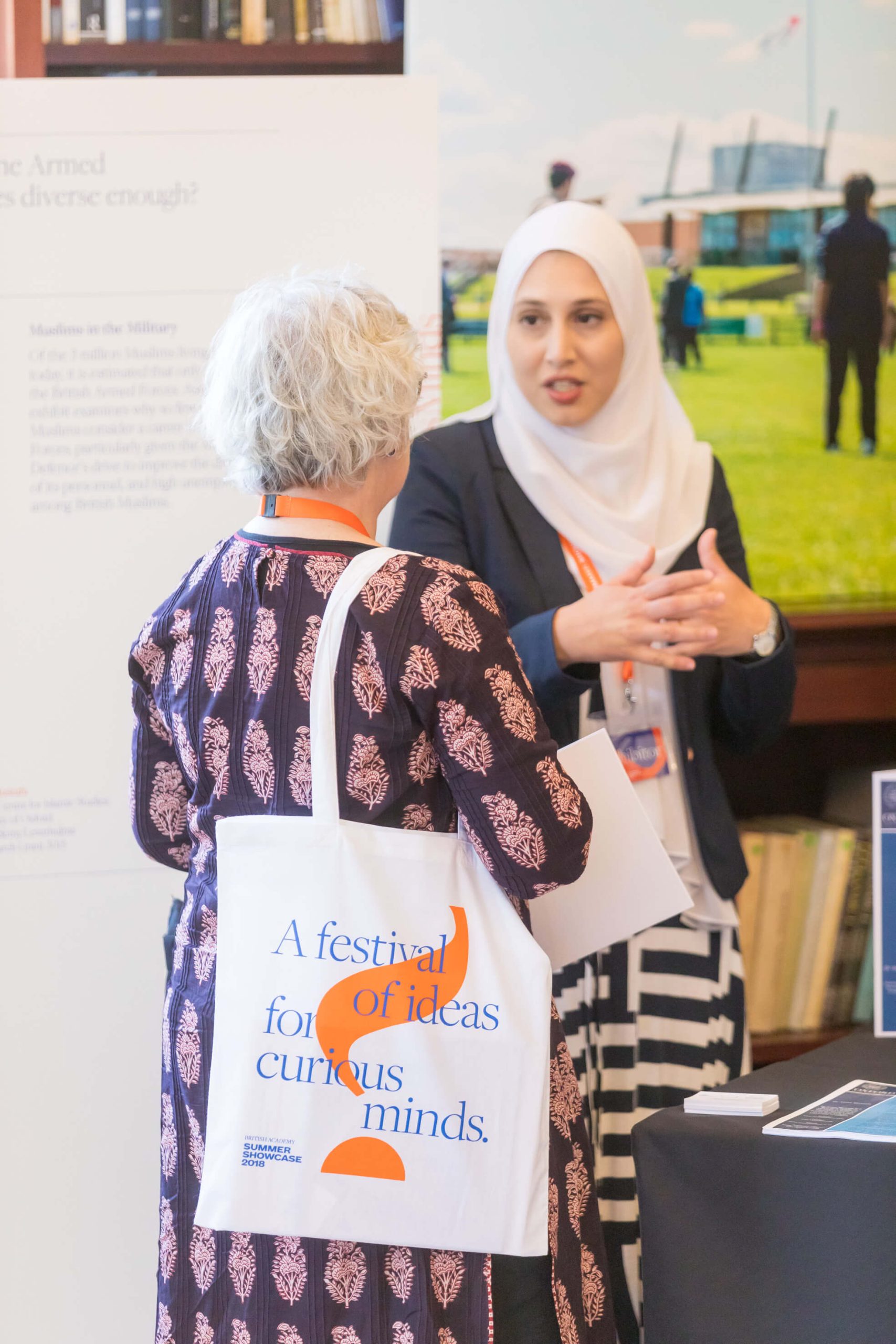 Asma talking to woman Asma talking to woman